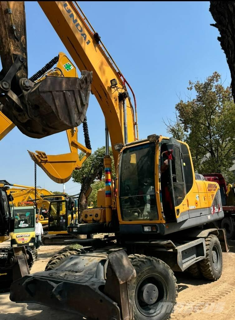 Hyundai 210W-9 حفارات بعجل