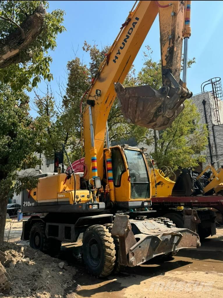 Hyundai 210W-9 حفارات بعجل