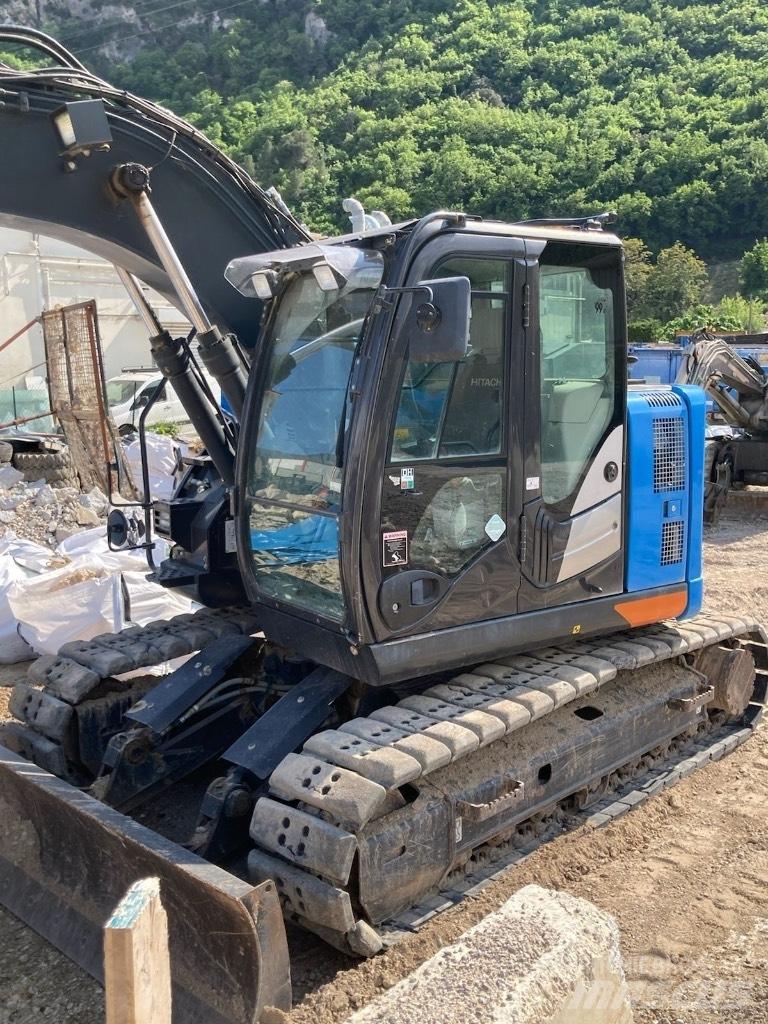 Hitachi ZX 135 US-6 حفارات زحافة
