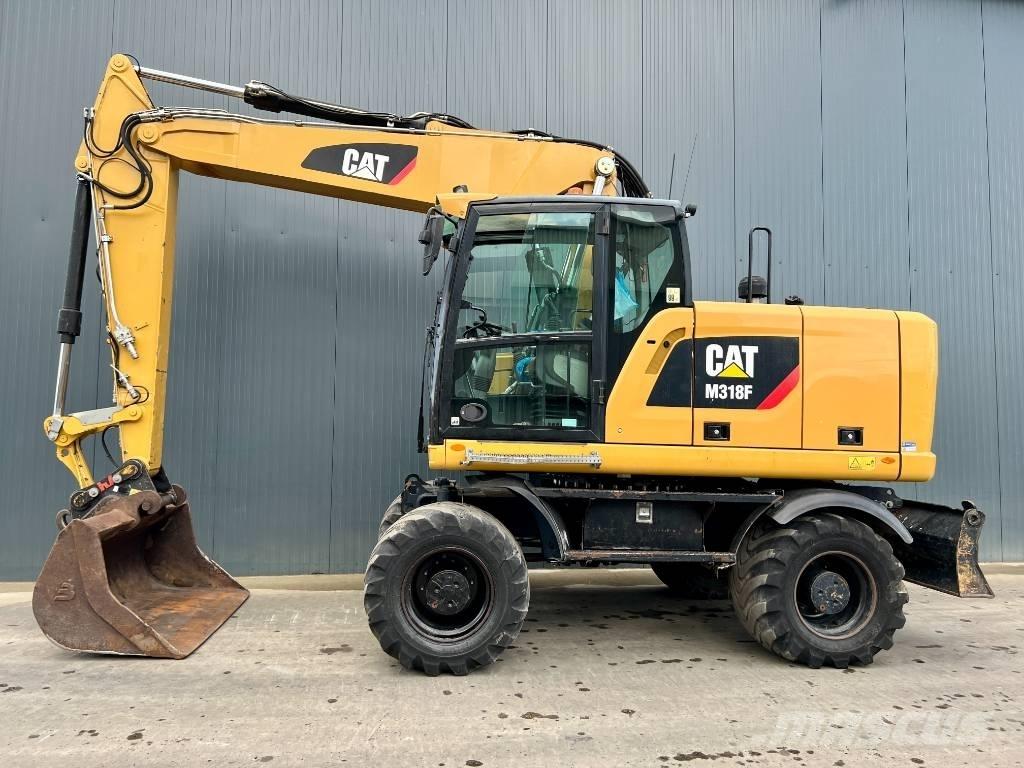 CAT M318F حفارات بعجل