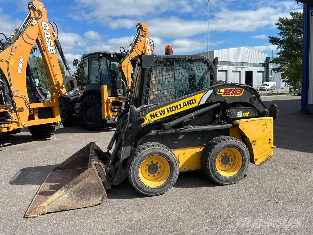 New Holland L 218 لوادر انزلاقية التوجيه
