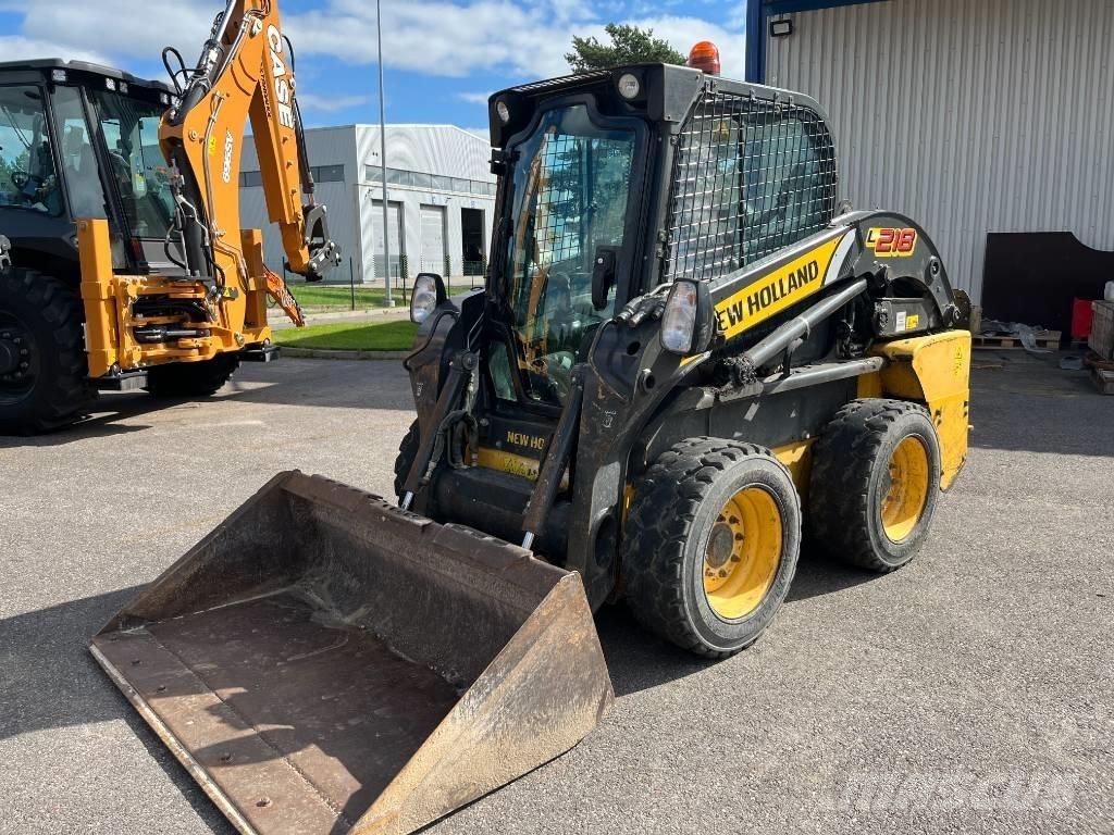 New Holland L 218 لوادر انزلاقية التوجيه