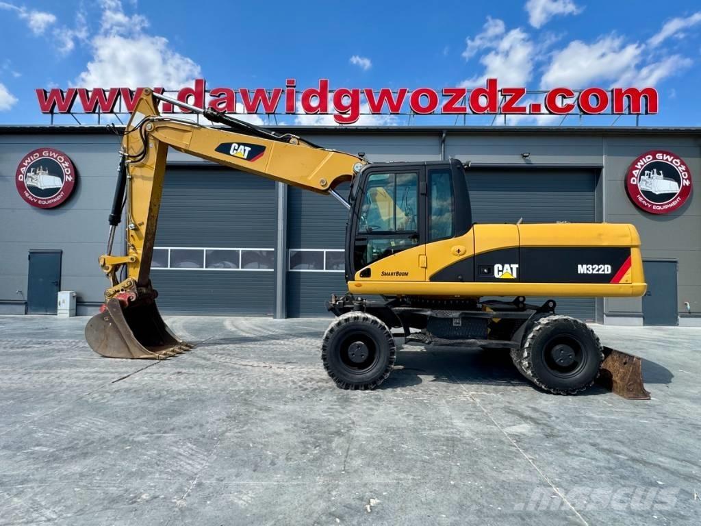 CAT M 322 D حفارات بعجل