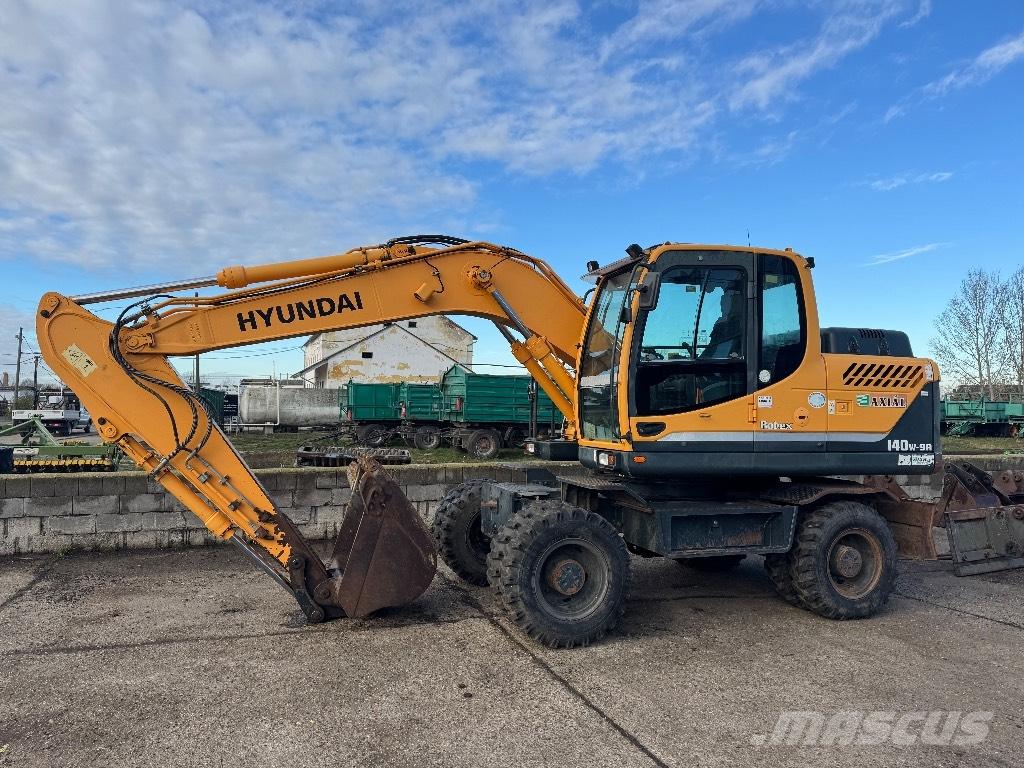 Hyundai R140W-9A حفارات بعجل