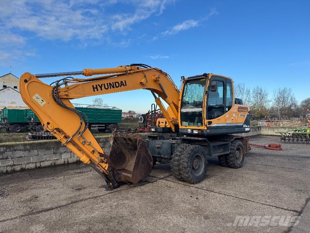 Hyundai R140W-9A حفارات بعجل