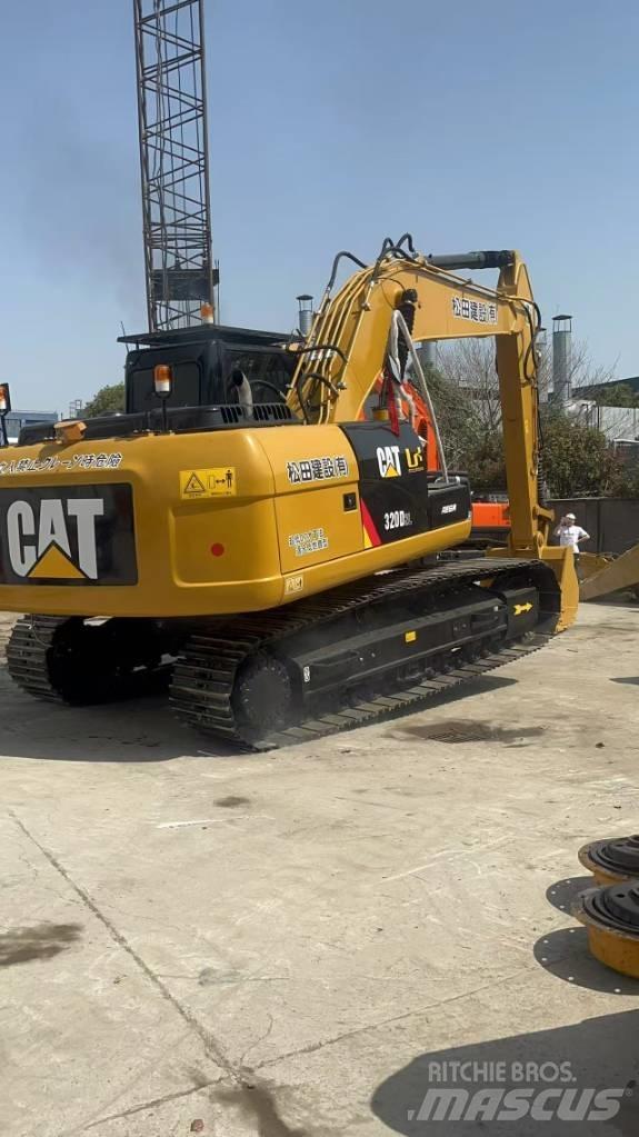 CAT 320 D L حفارات زحافة