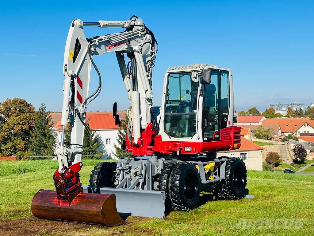 Takeuchi TB 295 W حفارات بعجل