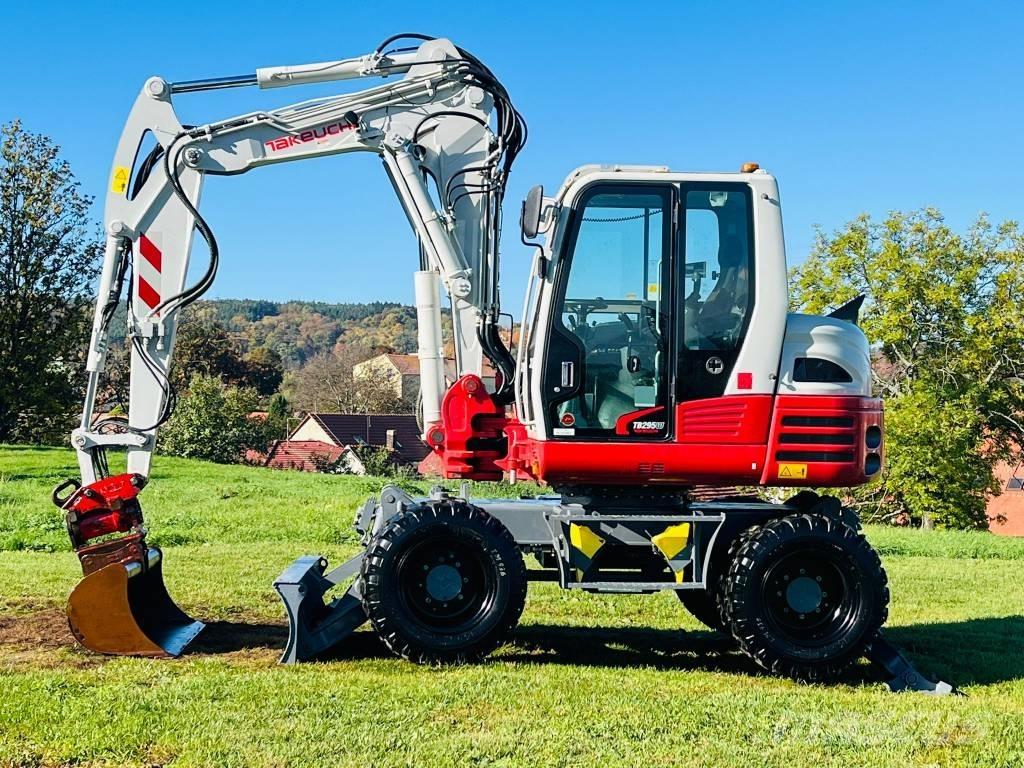 Takeuchi TB 295 W حفارات بعجل