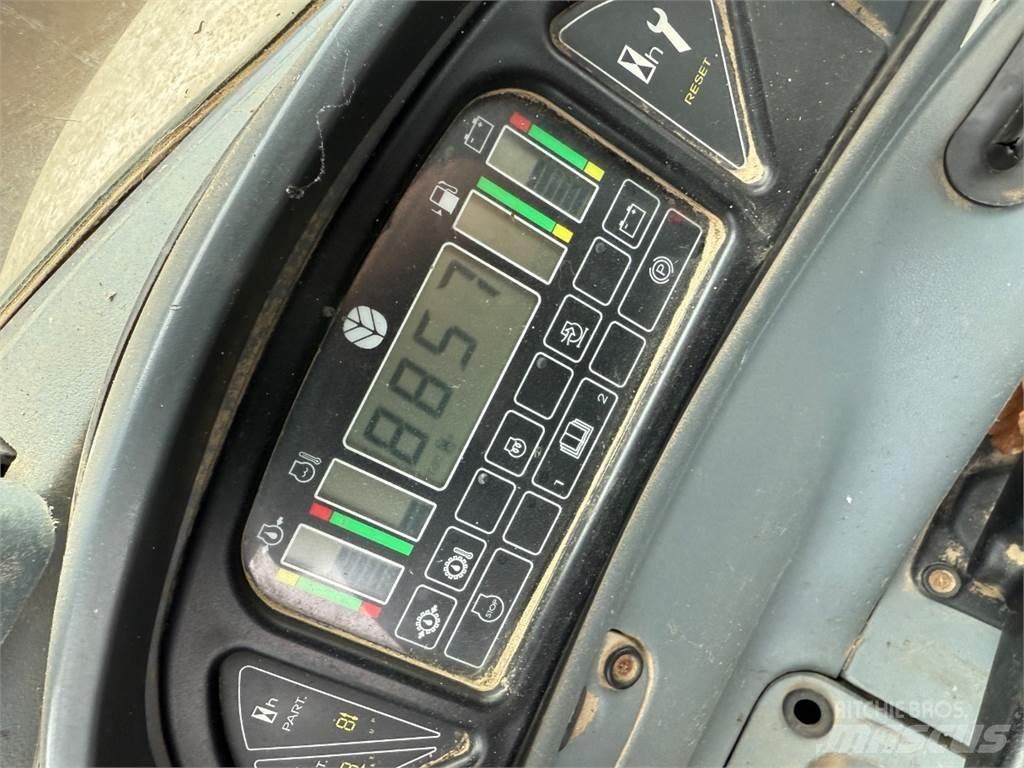 New Holland NH95 لوادر ذات جرافات عكسية