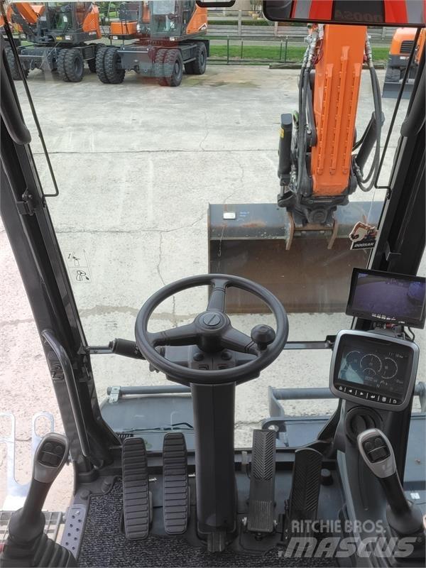 Doosan DX140W-5 حفارات بعجل