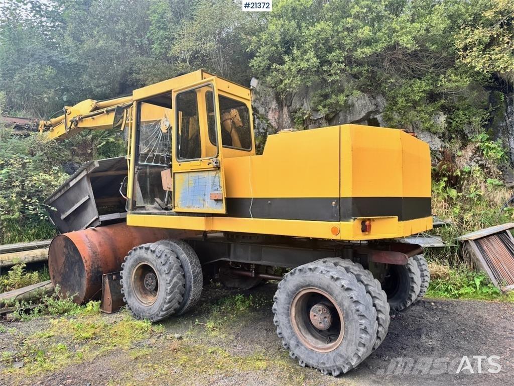 CAT 212B حفارات بعجل
