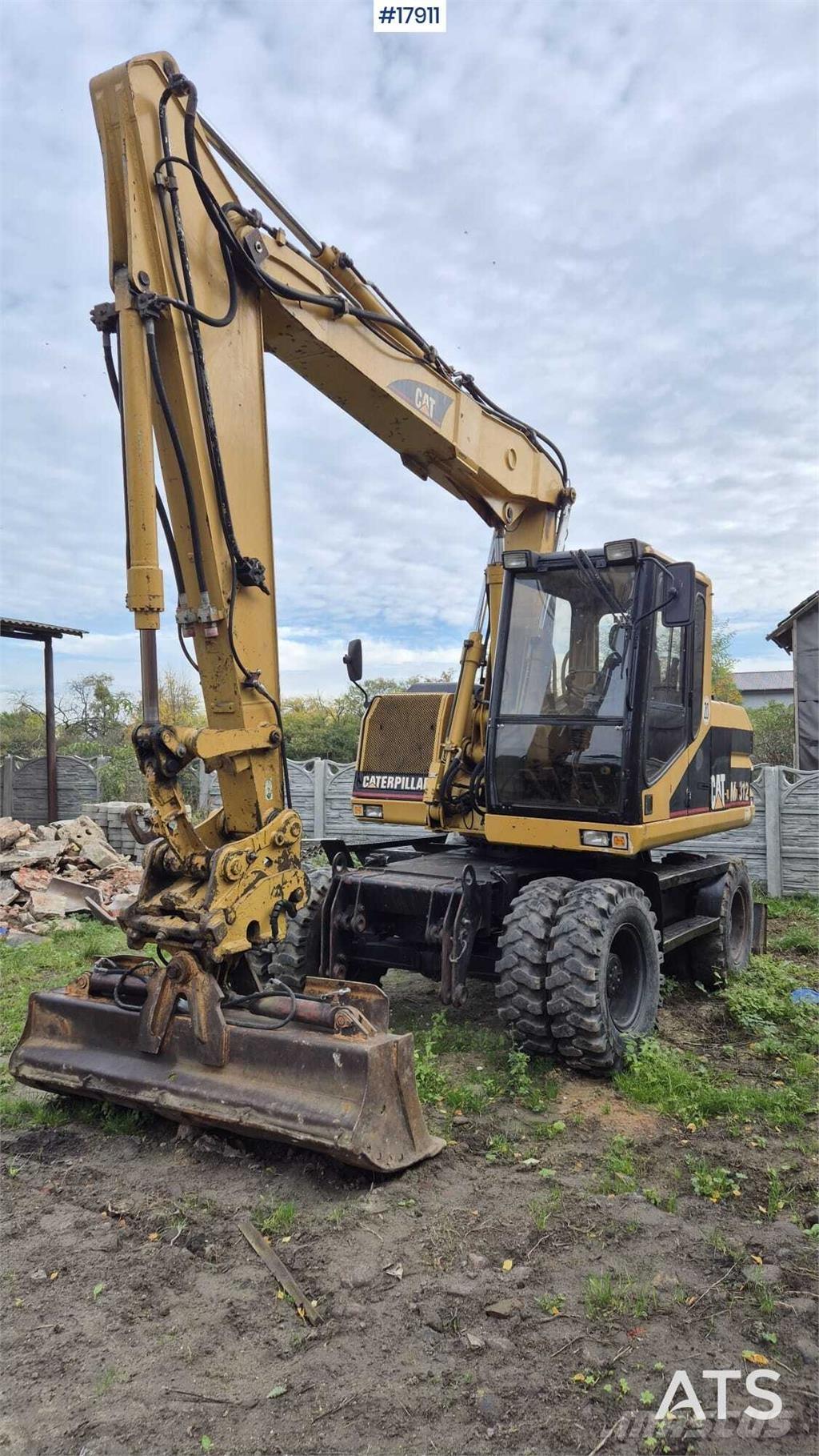 CAT M312 حفارات بعجل
