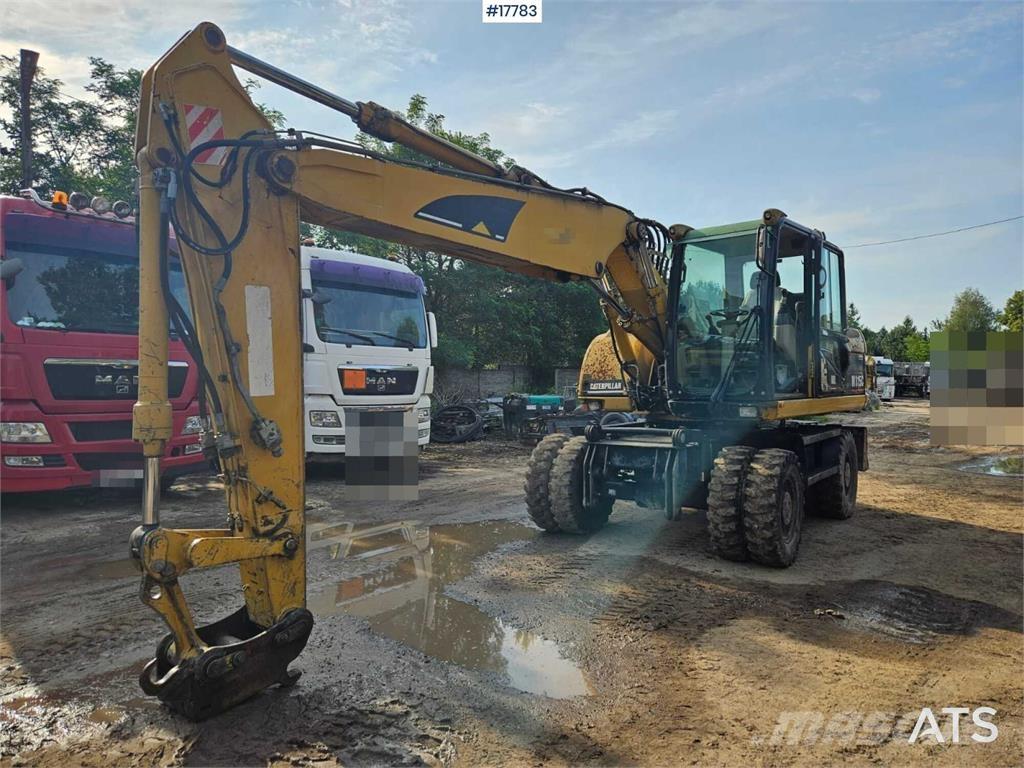 CAT M315C حفارات بعجل