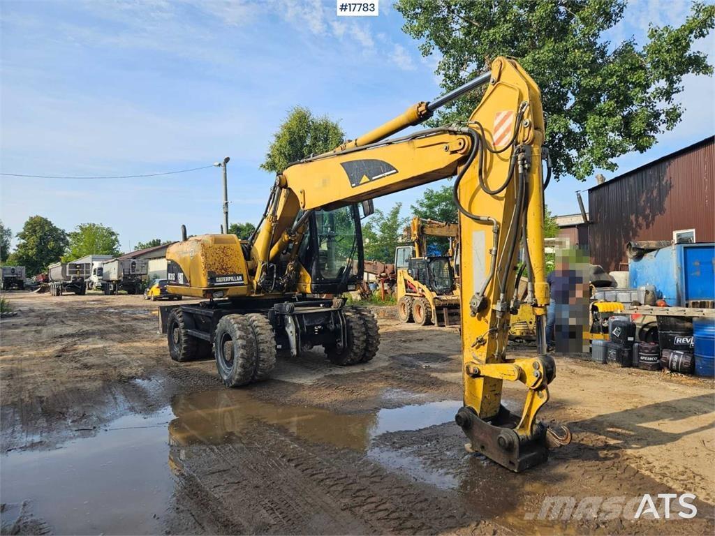 CAT M315C حفارات بعجل