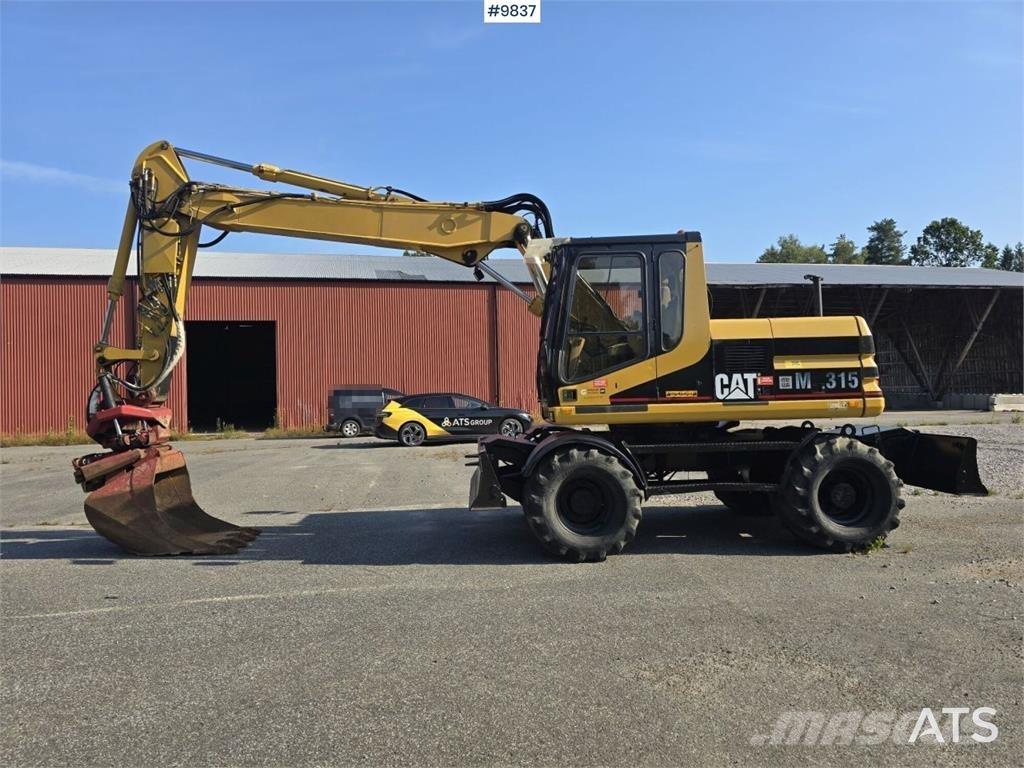 CAT M315 حفارات بعجل