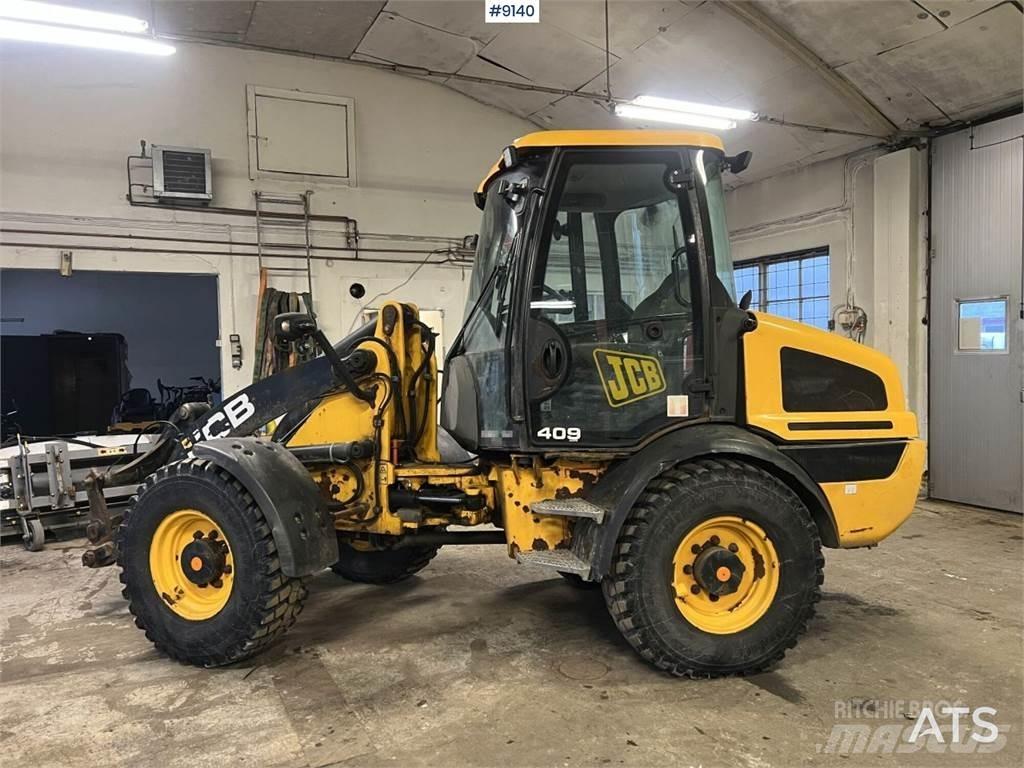 JCB 409 T4 بلدوزرات بعجلات
