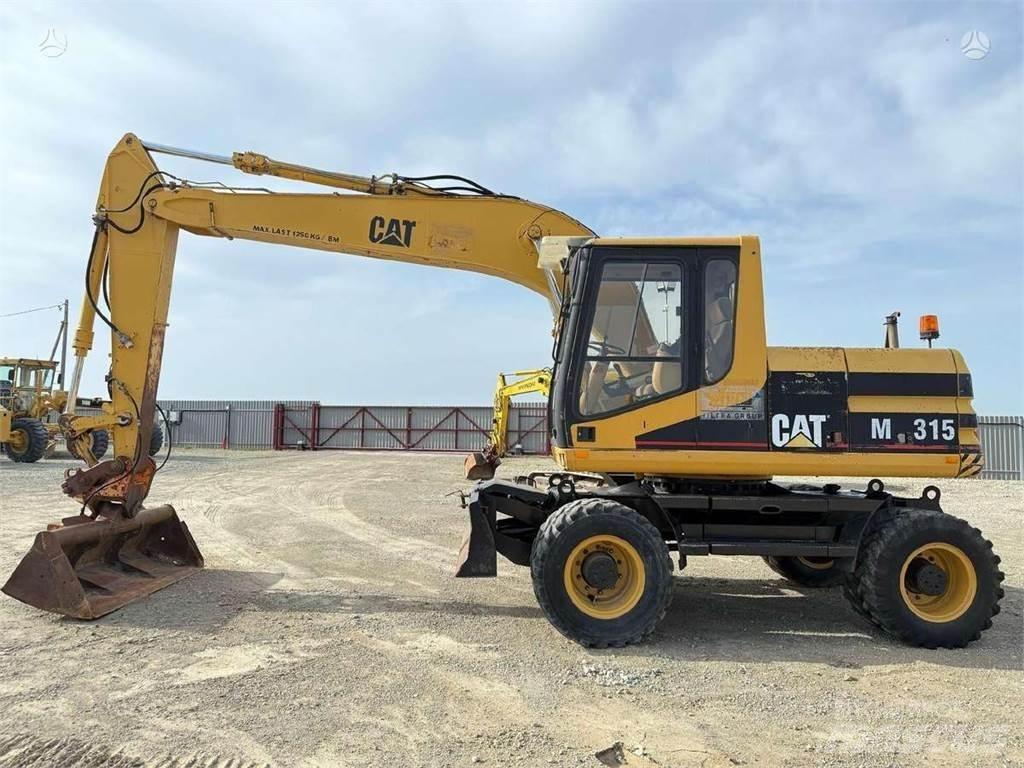 CAT M 315 حفارات بعجل