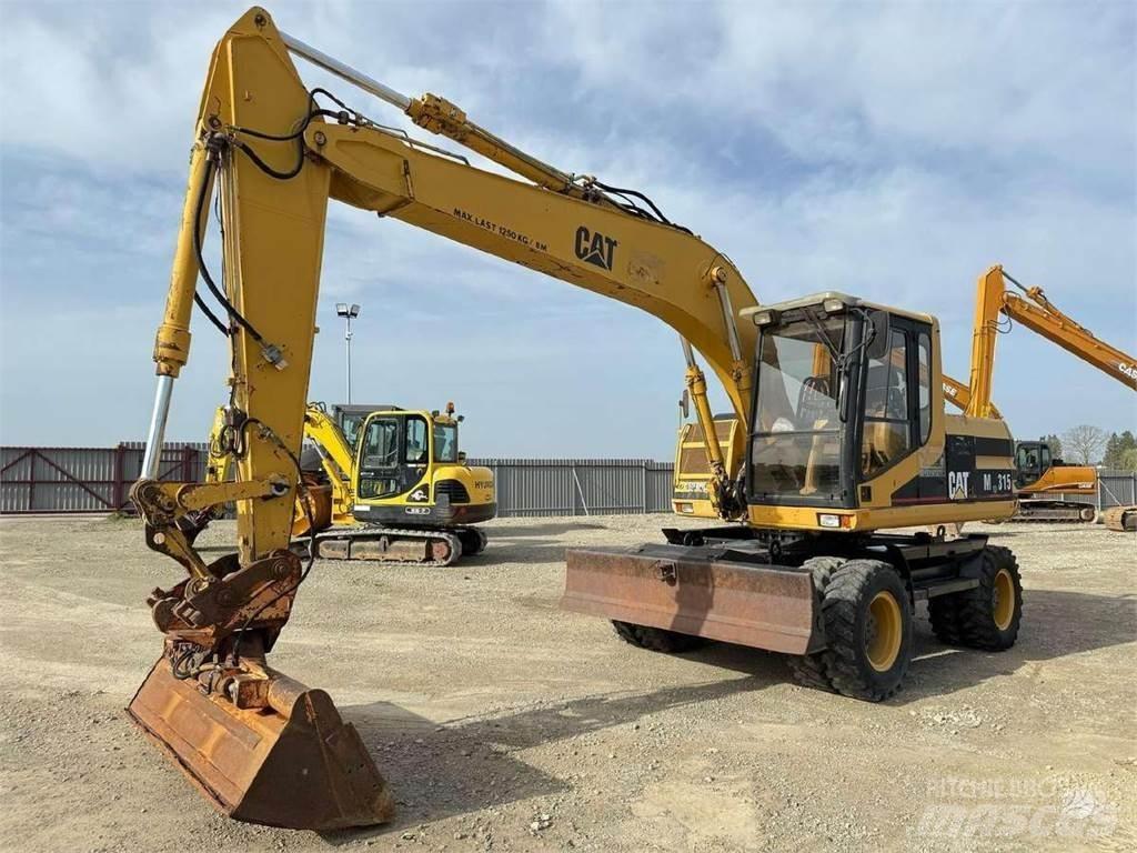CAT M 315 حفارات بعجل