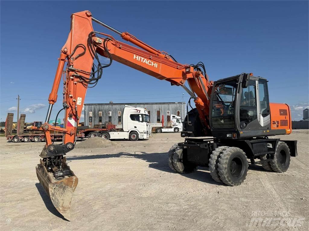 Hitachi ZX 140 W حفارات بعجل