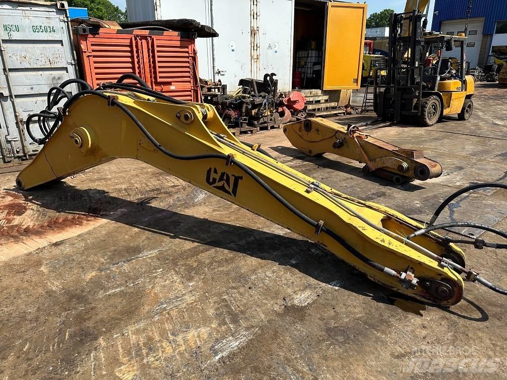 CAT 214 B FT boom حفارات بعجل