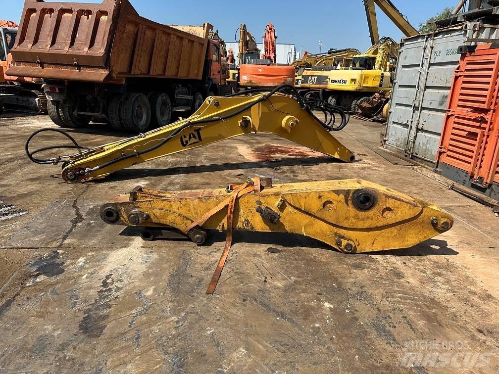 CAT 214 B FT boom حفارات بعجل