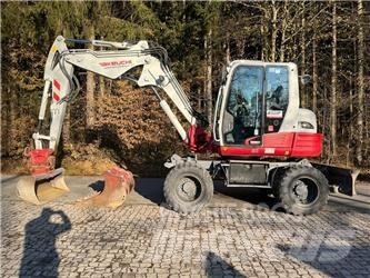 Takeuchi TB295W حفارات بعجل