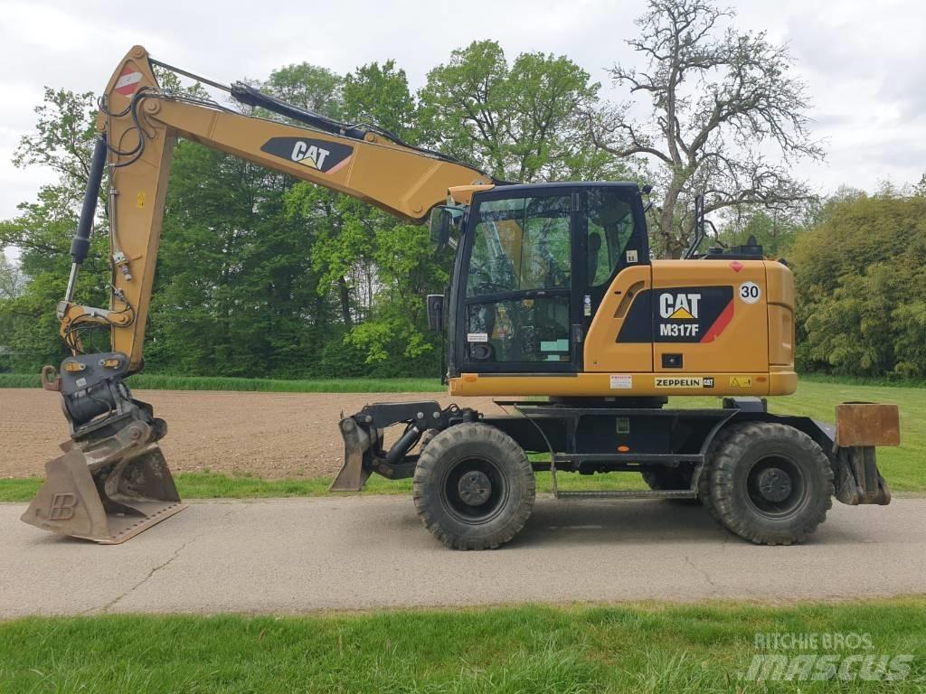 CAT M 317 F حفارات بعجل