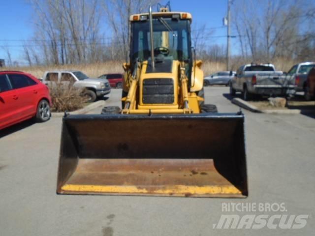 New Holland 575 E لوادر ذات جرافات عكسية