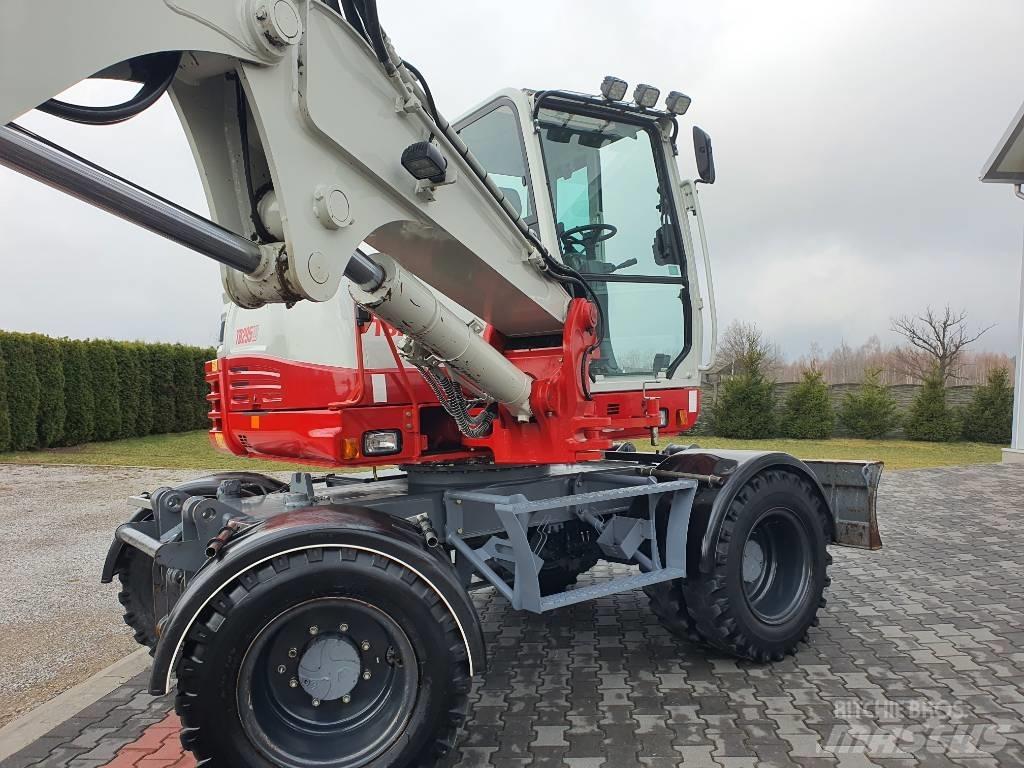 Takeuchi TB 295 W حفارات بعجل