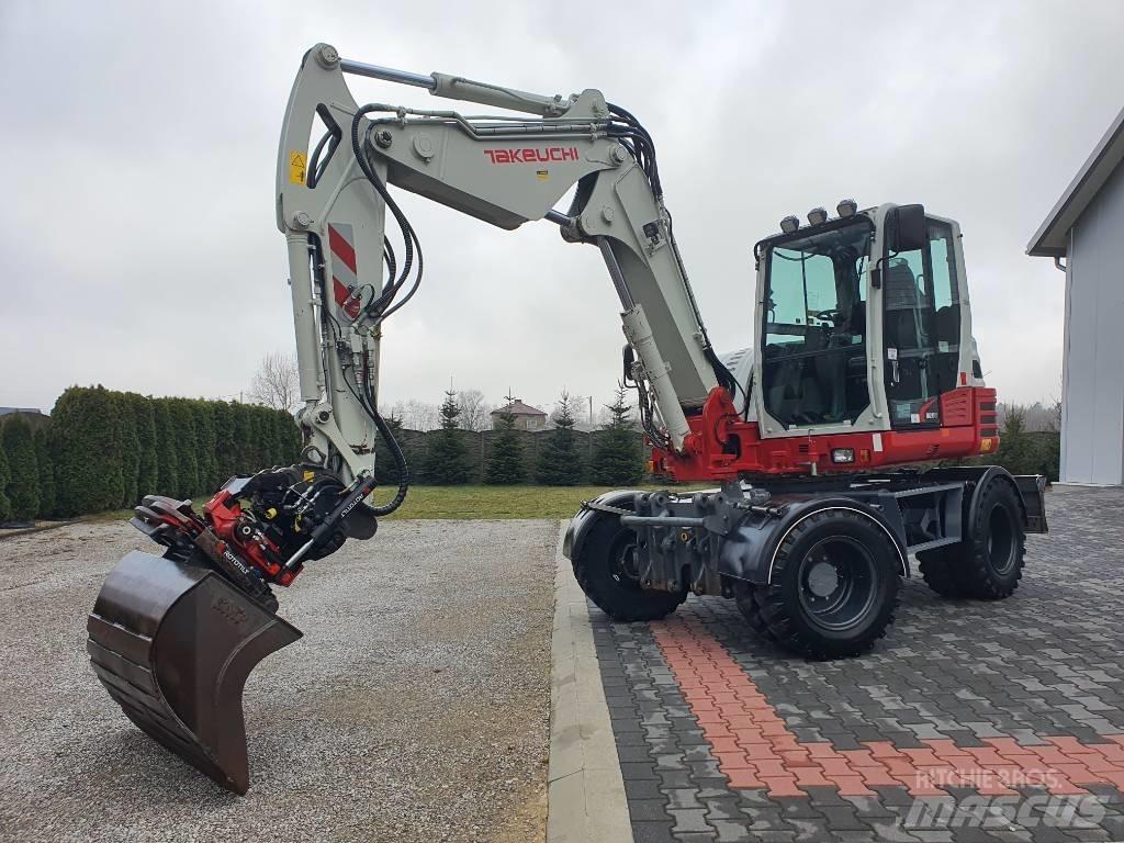 Takeuchi TB 295 W حفارات بعجل