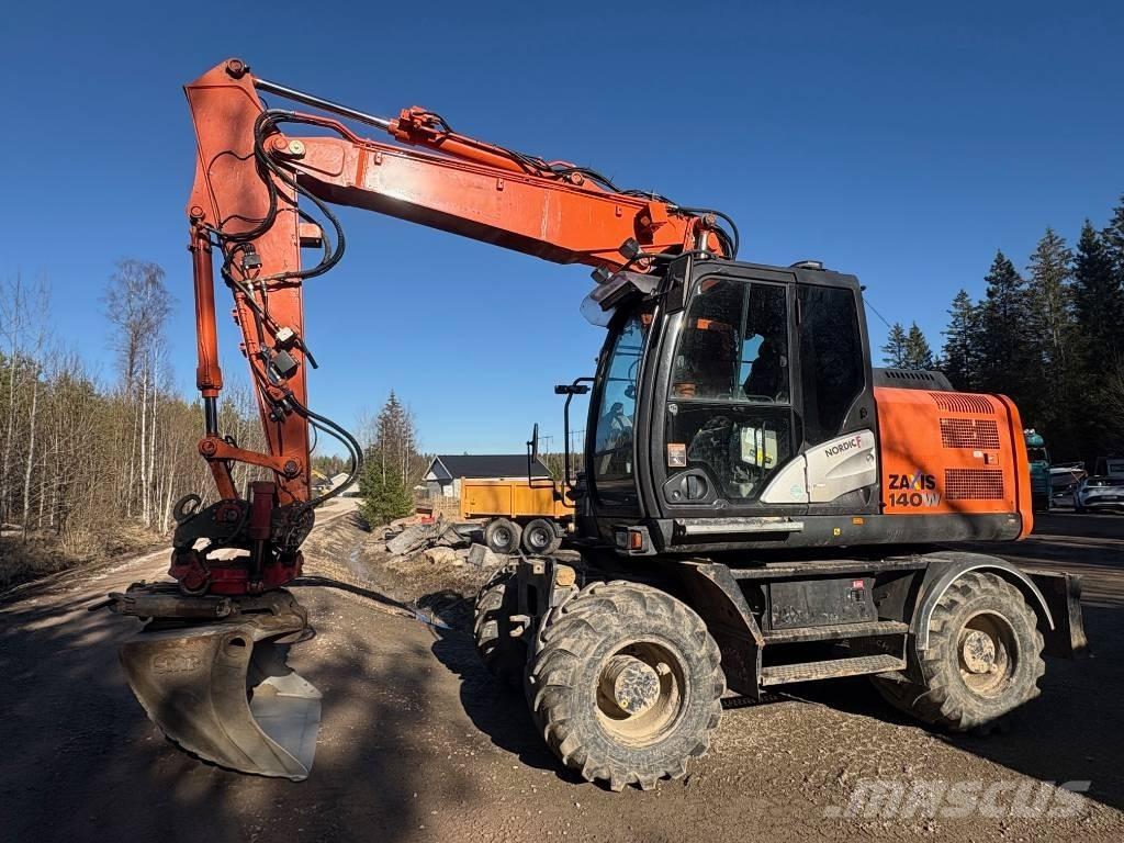 Hitachi ZX 140 W-5B حفارات بعجل