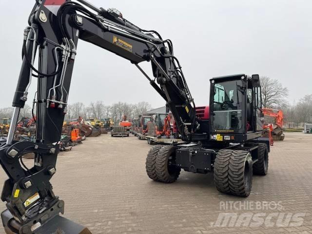 Yanmar B 110 W حفارات بعجل