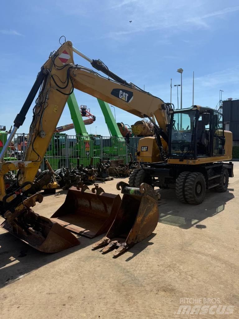 CAT M 318 F حفارات بعجل