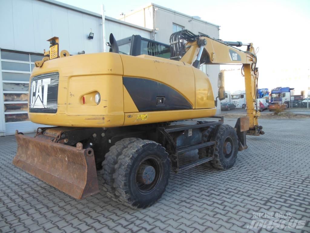 CAT M 316 D حفارات بعجل
