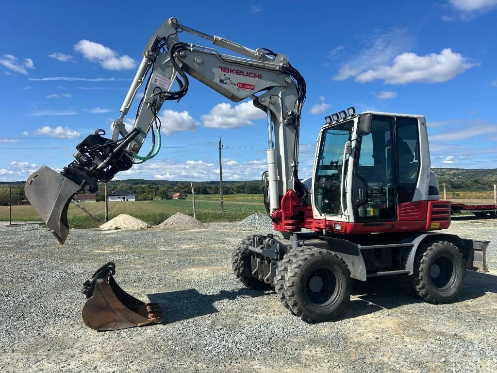 Takeuchi TB 295 W حفارات بعجل