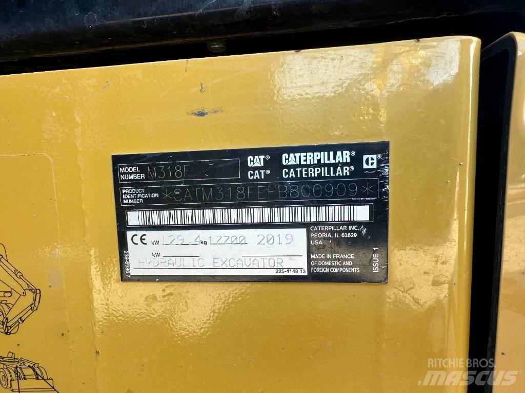 CAT M 318 F حفارات بعجل