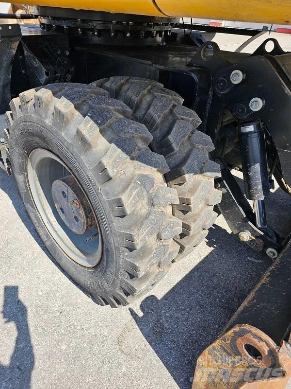 CAT M 318 F حفارات بعجل