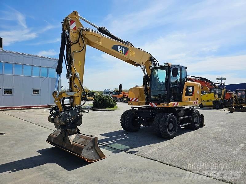 CAT M 318 F حفارات بعجل