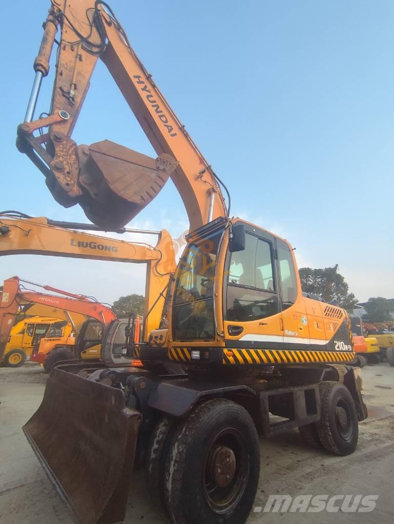 Hyundai 210W-9 حفارات بعجل