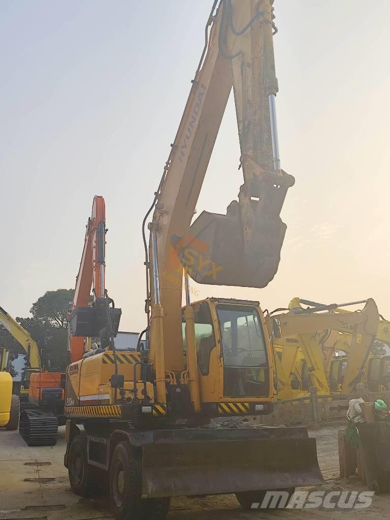 Hyundai 210W-9 حفارات بعجل