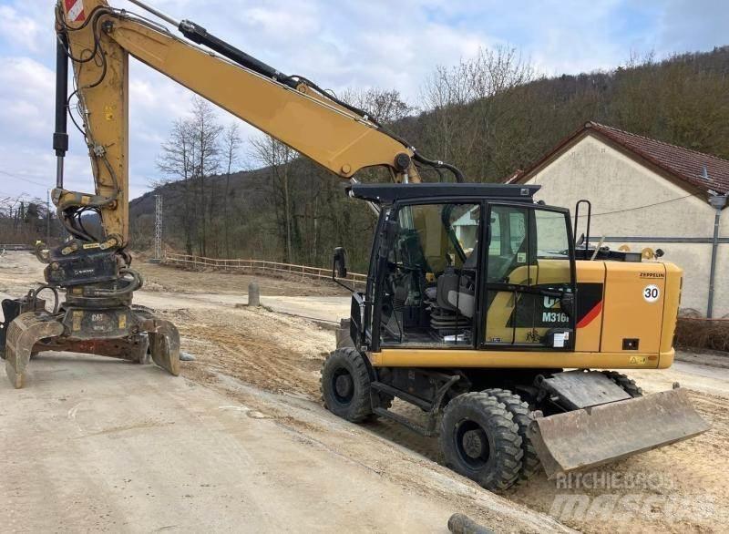 CAT M316F حفارات بعجل