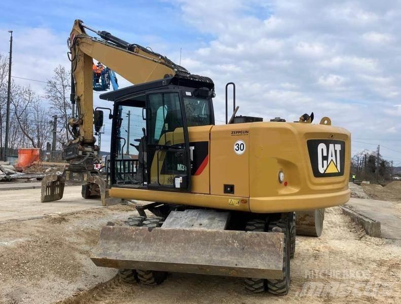 CAT M316F حفارات بعجل