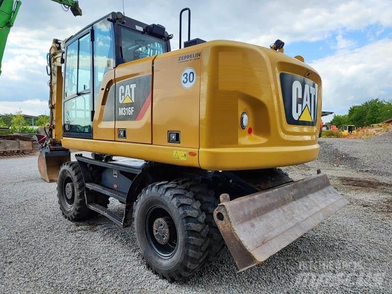 CAT M316F حفارات بعجل