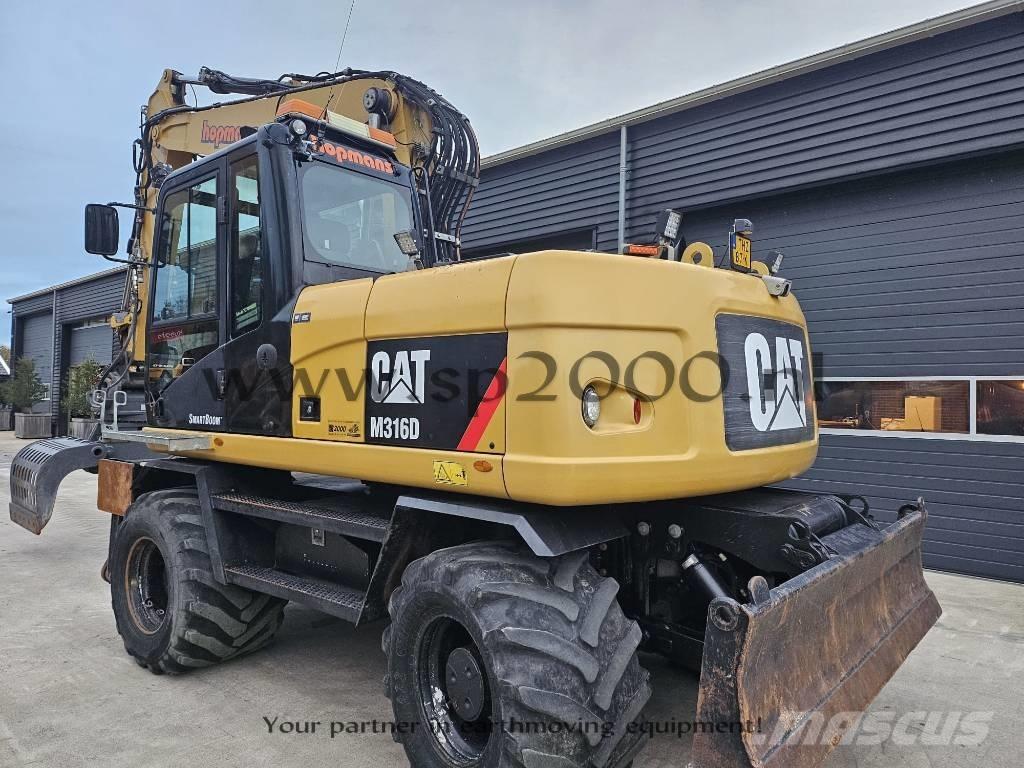 CAT M 316 D حفارات بعجل