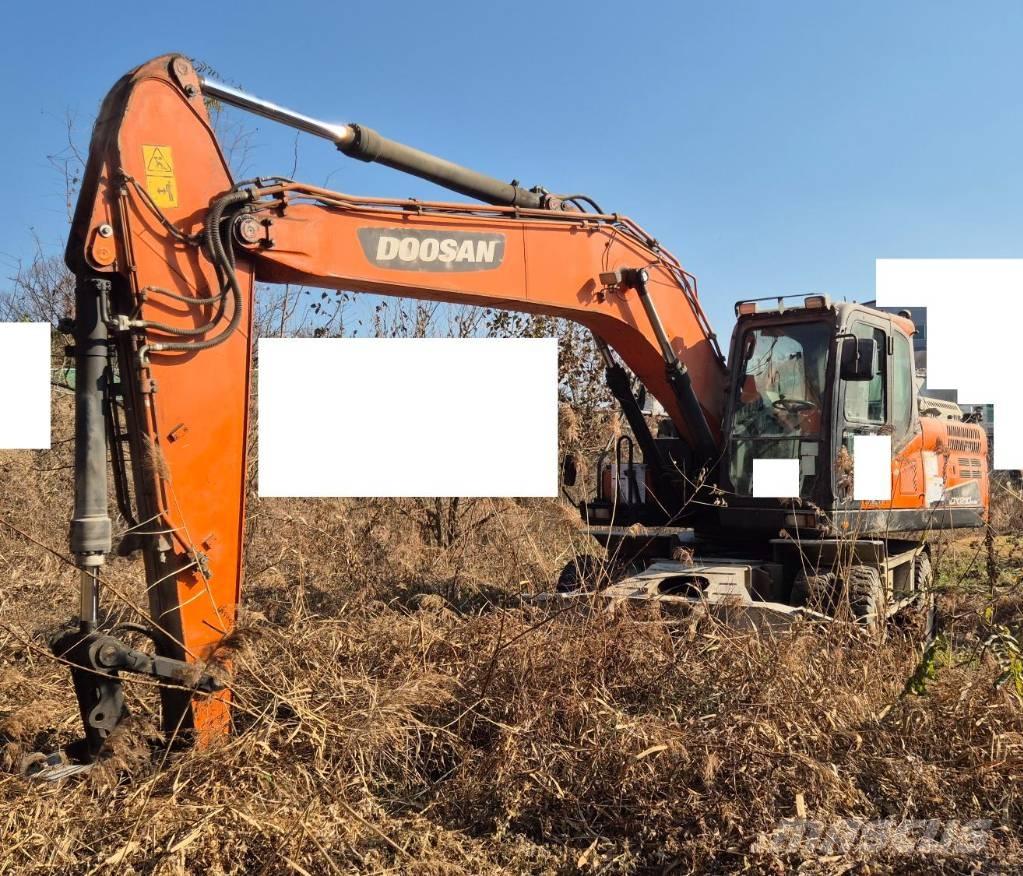 Doosan DX 210 W حفارات بعجل