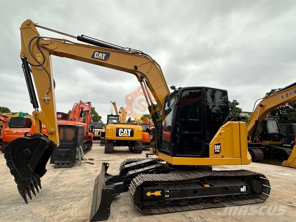 CAT 310 حفارات زحافة