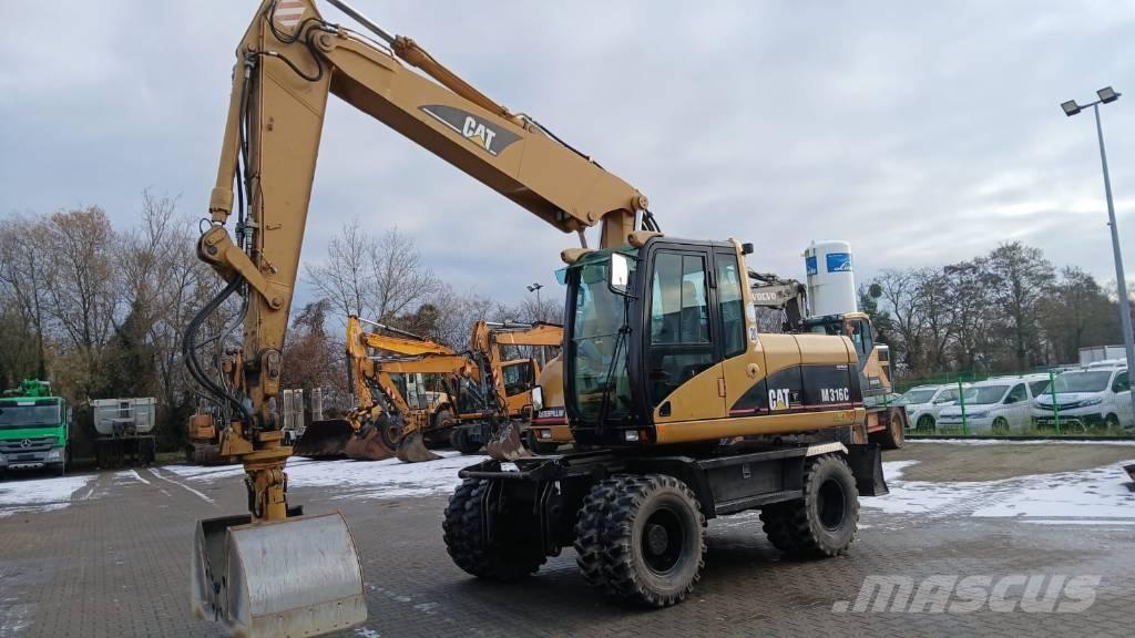 CAT M 316 C حفارات بعجل