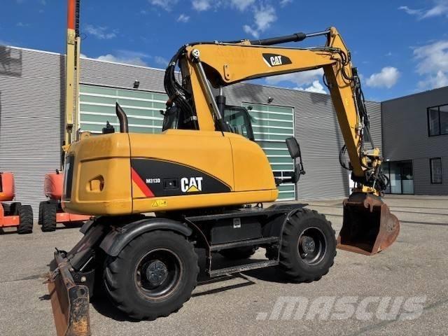 CAT M 313 D حفارات بعجل