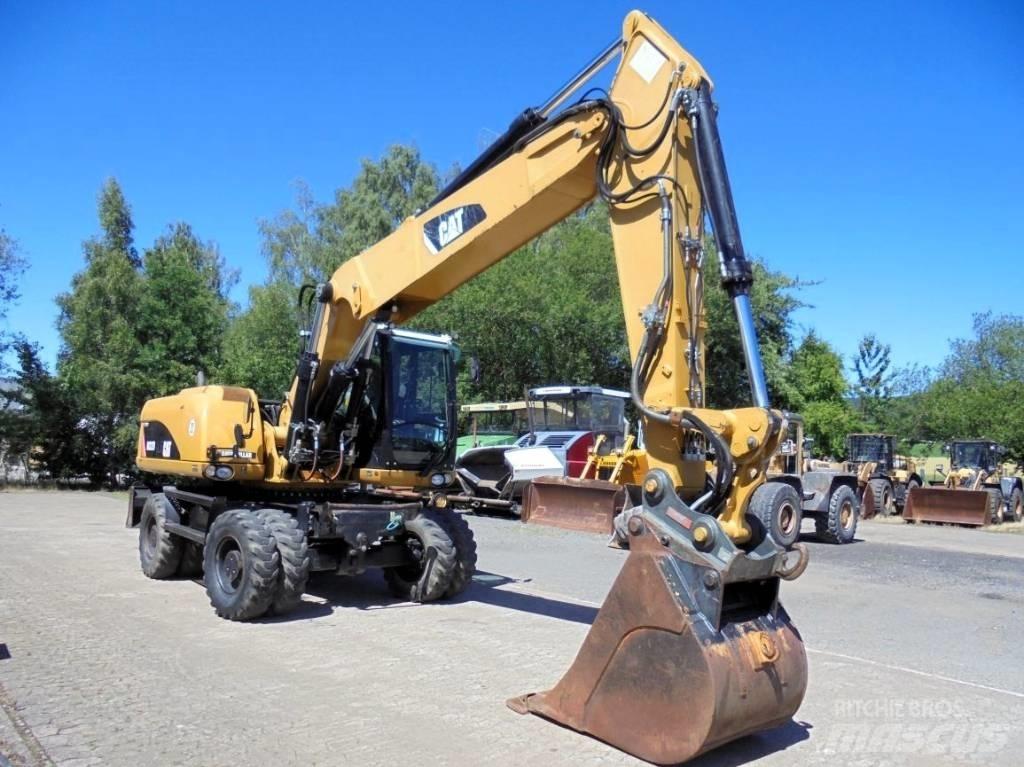 CAT M 322 D حفارات بعجل