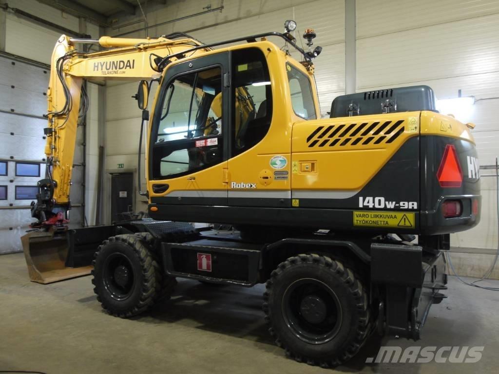 Hyundai R 140 W-9A حفارات بعجل